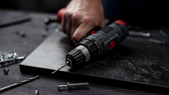 Hand holding a power tool