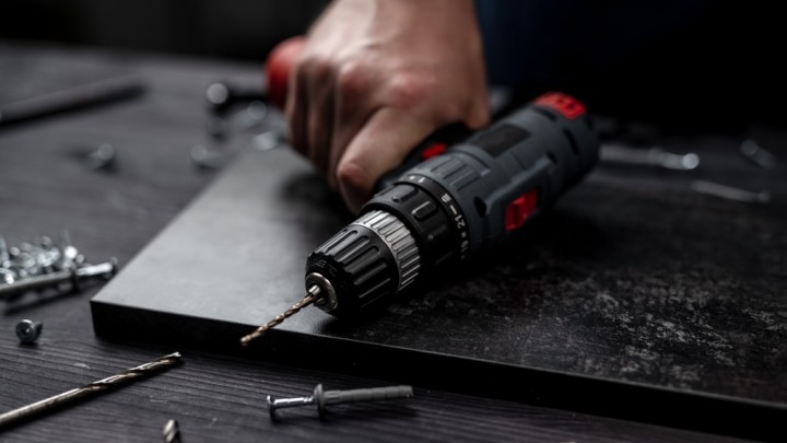 Hand holding a power tool